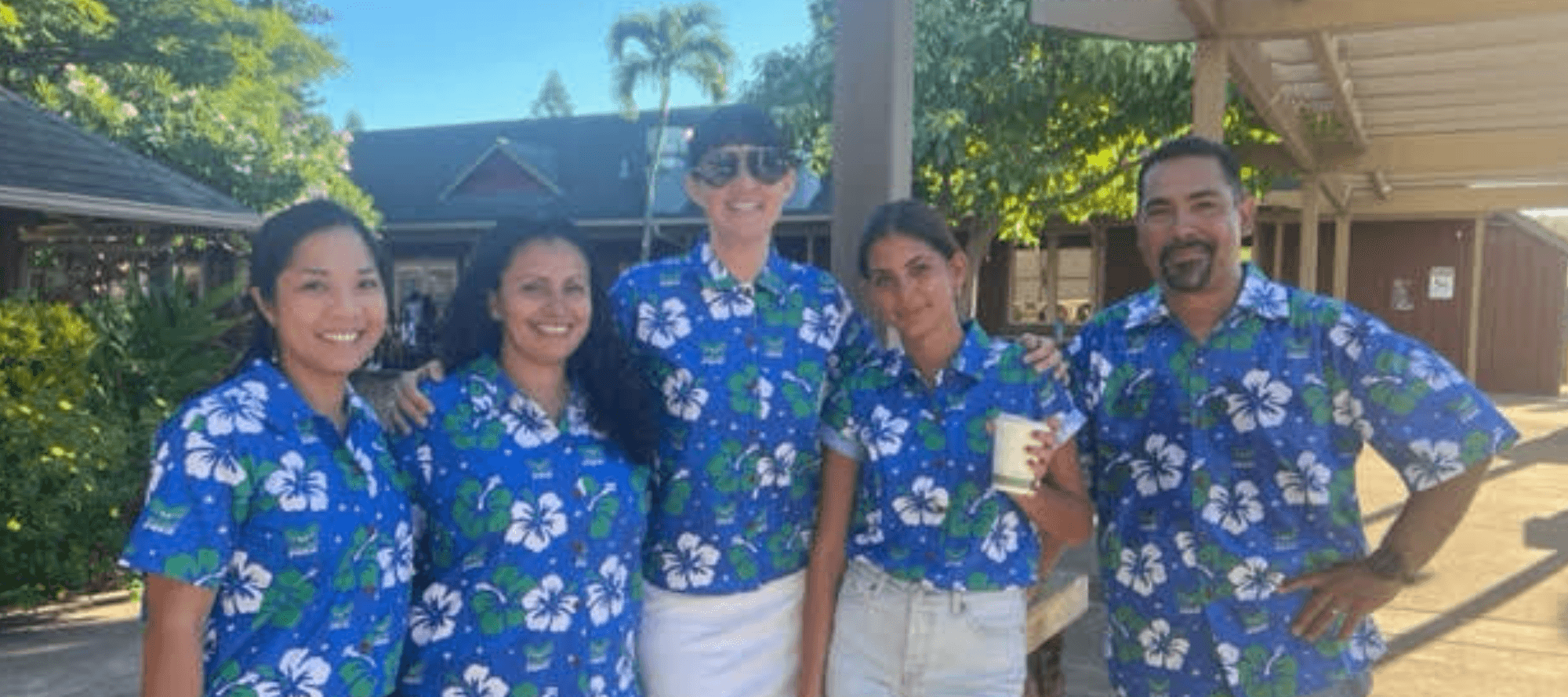 A group photo of people wearing Maui Prep Hawaiian shirts.